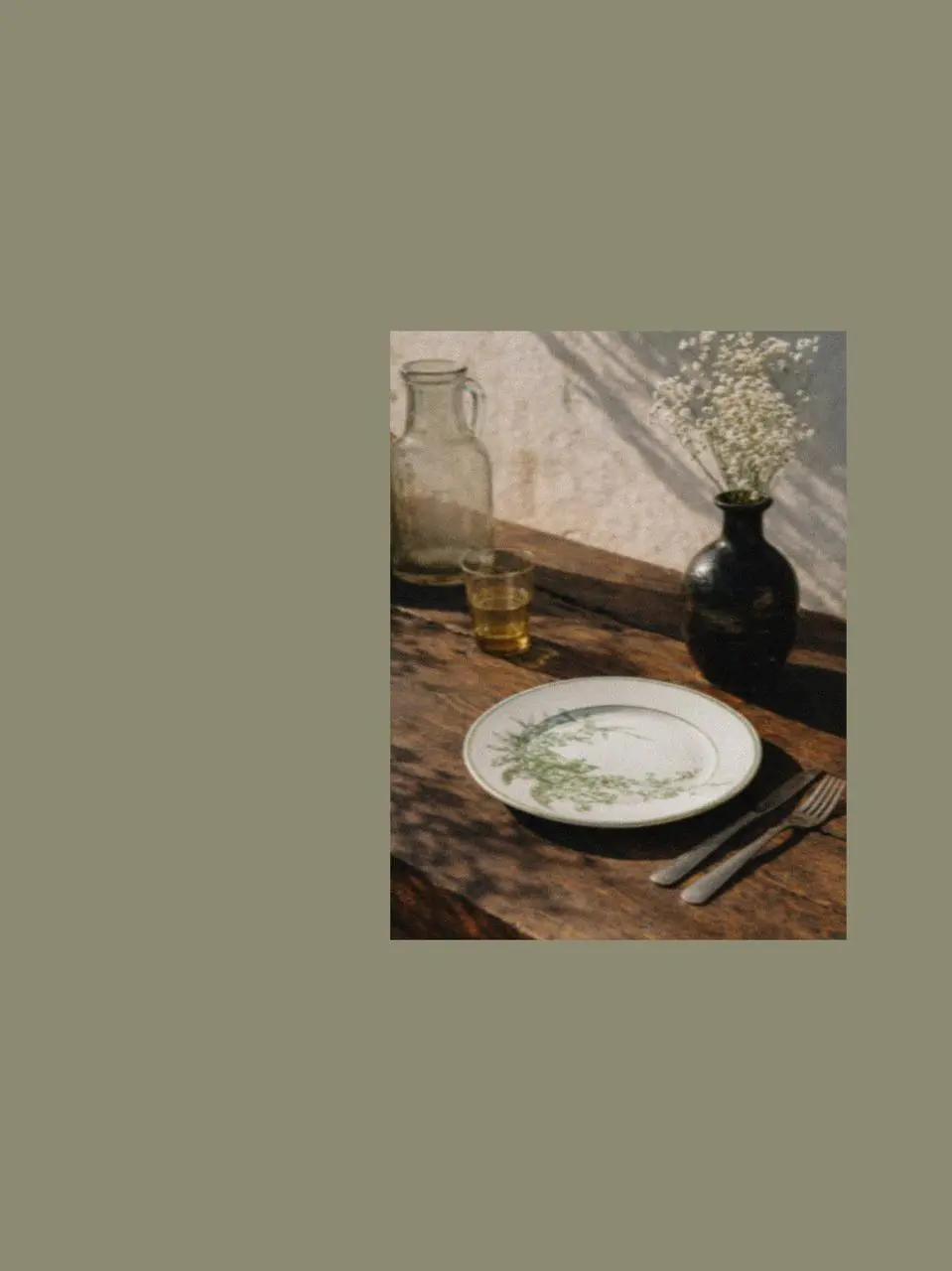 Botanical ceramic plate with delicate green pattern placed on a rustic wooden table, styled as elegant decorations for a dining room table with natural dining table accessories for spring in UK.
