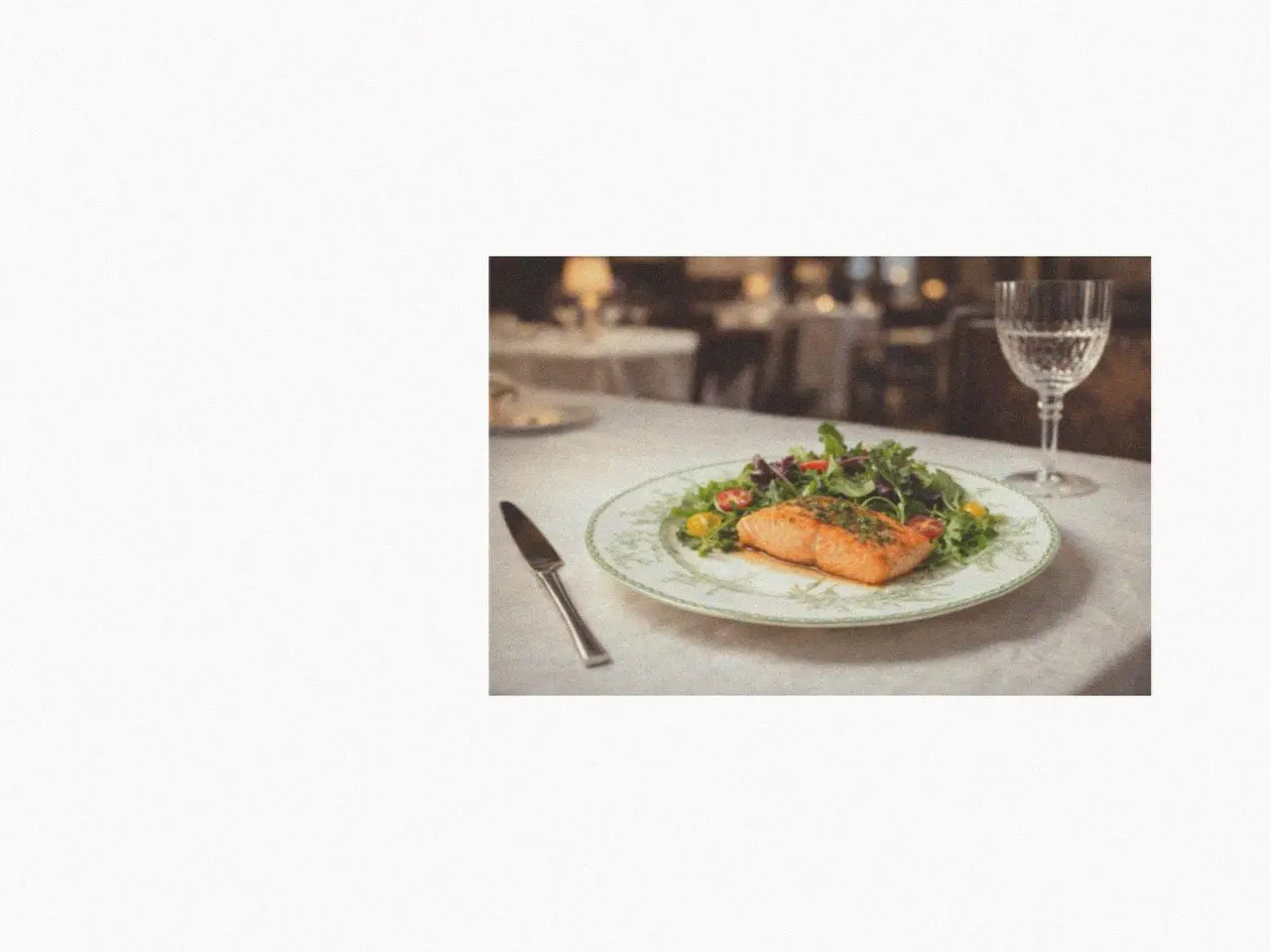 salmon salad served on a lily of the valley ceramic dinnerware set plate in an elegant table centerpiece dining setting.
