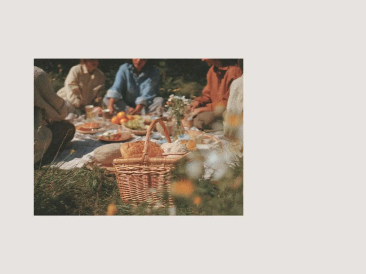 Group enjoying an outdoor picnic with easter table decorations, easter plates, picnic cutlery, and designer tableware, creating a relaxed spring setting with thoughtful gift suggestions for easter.