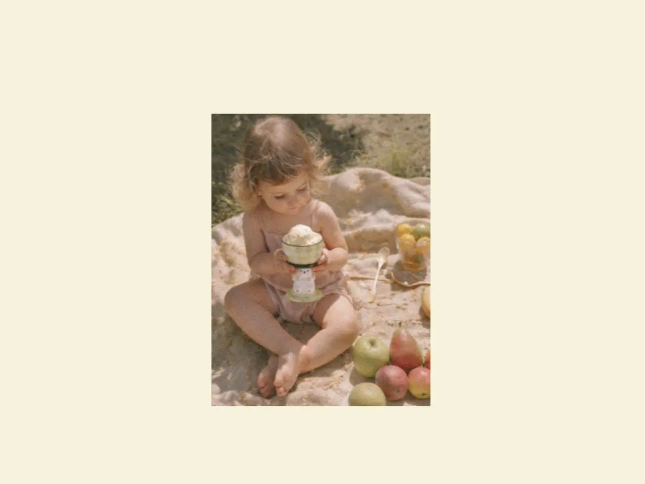 Child enjoying dessert from ice cream cups during a family picnic, with picnic cutlery and a soft picnic dinnerware set creating a relaxed picnic afternoon tea atmosphere outdoors.
