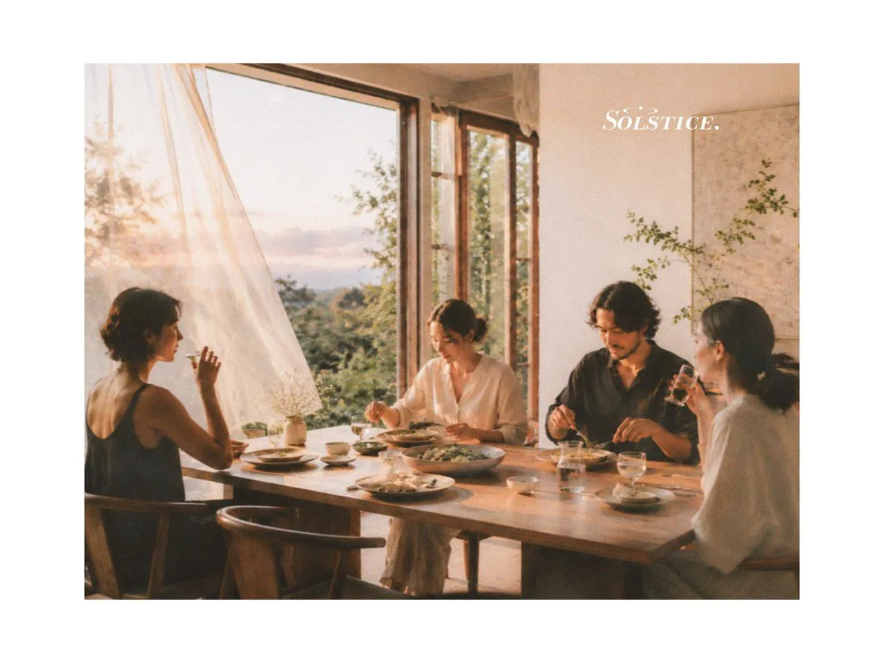 Evening dining table with picnic dinnerware, ceramic plates set, salad plates, and a large salad bowl, styled with designer tableware for a relaxed shared meal in soft natural light.