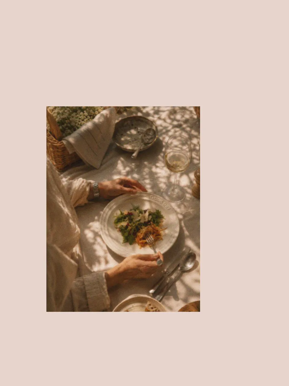 Close-up of salad plates with fresh food and picnic cutlery on a table, creating a relaxed family picnic and picnic afternoon tea setting with simple picnic accessories in soft natural light.