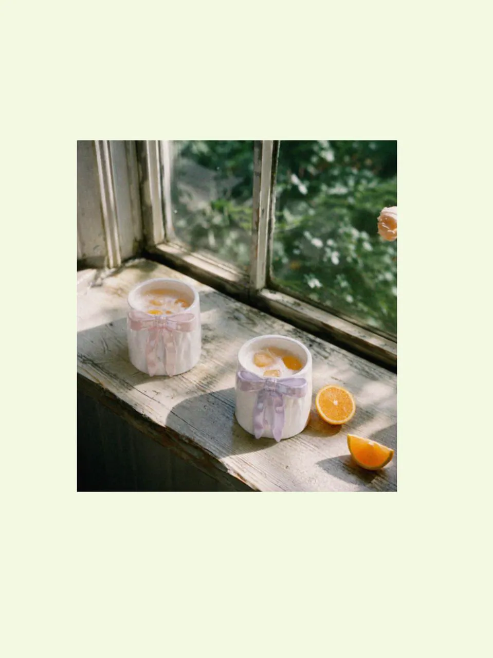 Mugs gift set and mugs for latte placed by the window with citrus and summery things, styled as a designer coffee mug pairing with soft beach shell-inspired summer charm.