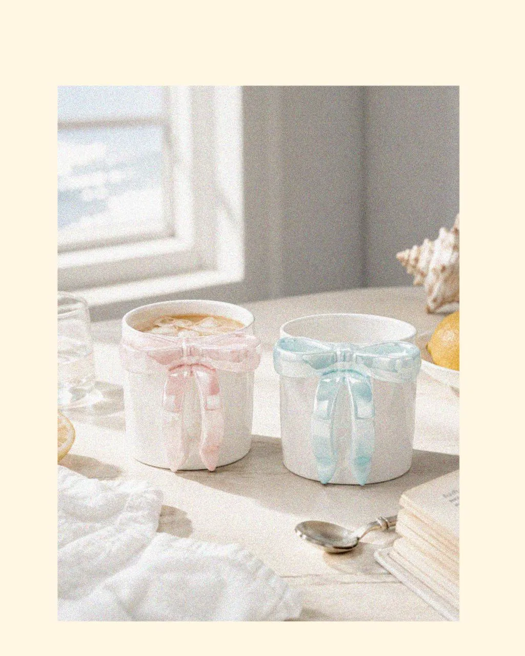 Ocean Aurora Bow Mugs presented as a coordinated mugs gift set, styled with designer tableware, soft coastal colours, and beach shells, creating thoughtful things for the summer and versatile hot chocolate mugs for year-round use.