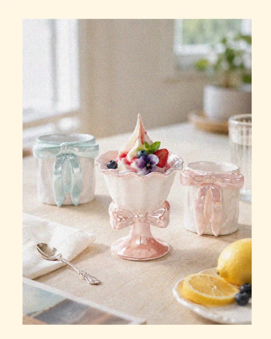 Decorative Ocean Aurora ice cream cups with pastel bow details, paired with a coordinating mugs gift set and designer tableware, inspired by beach shells and perfect as coastal things for the summer.