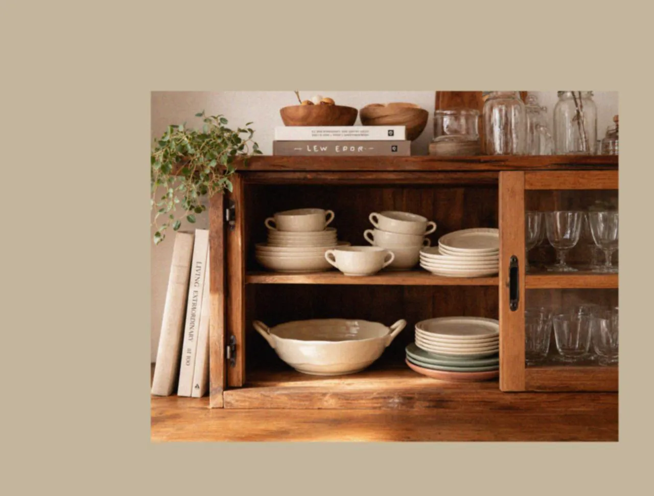 Cabinet styled with a picnic dinnerware set, ceramic dinner plates, and designer tableware, creating a practical and welcoming foundation for everyday meals and relaxed family picnic living.